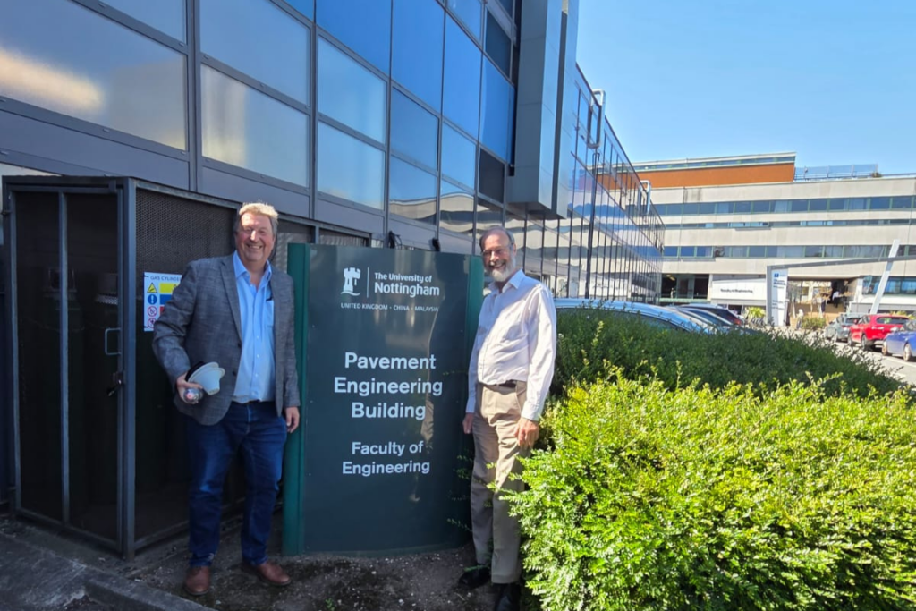 Steve Bays and Professor Nicholas Thom standing outside the Pavement Engineering Building at the University of Nottingham's Faculty of Engineering.